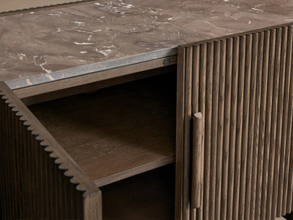 Astor Media Console with reeded oak wood detailing and natural marble top, features an open soft-close door revealing shelves inside.