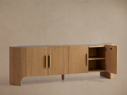 Astor Media Console with solid oak wood reeding, natural marble top, wooden pulls, and subtle brass accents.