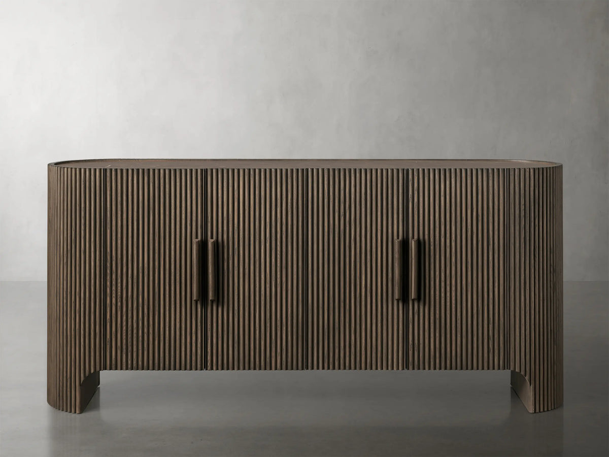Astor Sideboard with open cabinet showing oak veneer, wood reeding detail, and dark marble top, revealing spacious interior.