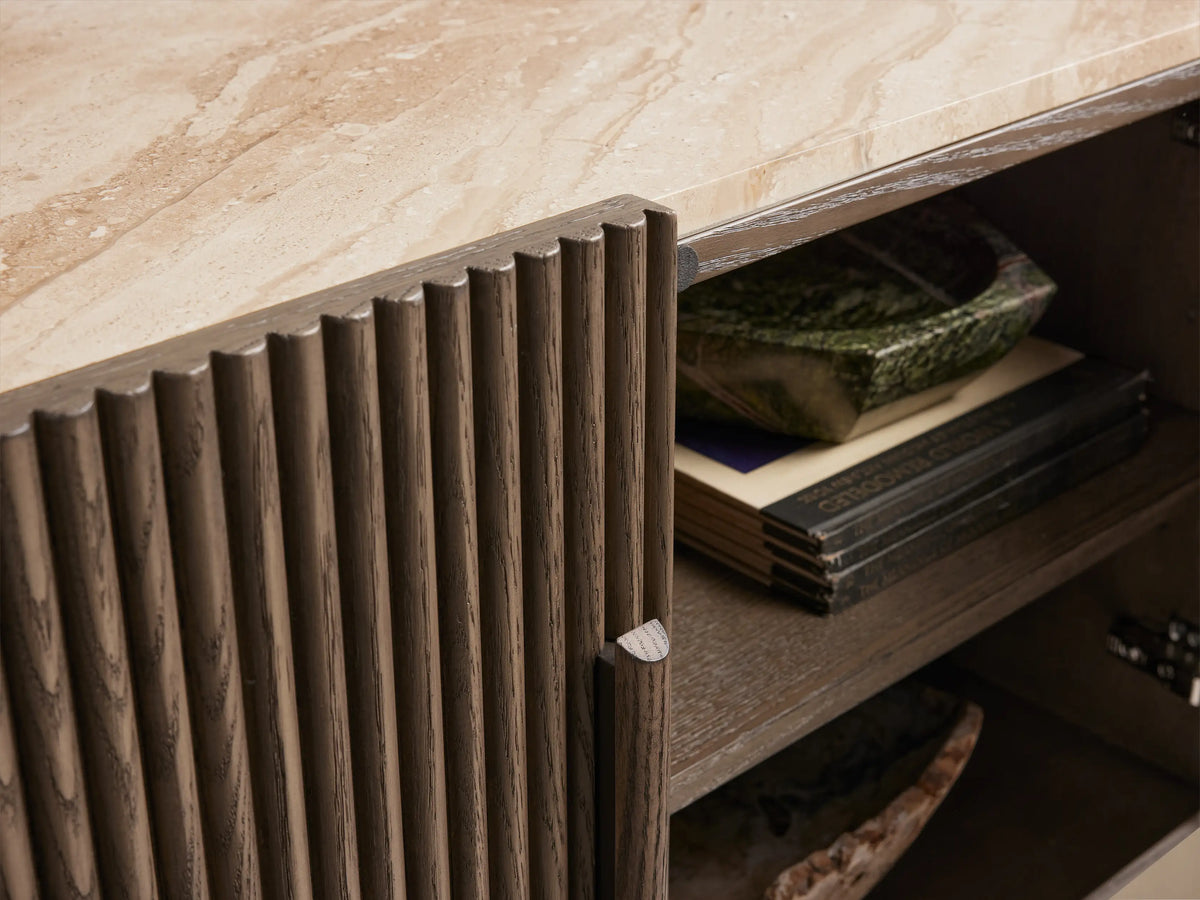 Astor Media Console: dark oak wood with vertical reeding, light marble top. Two central doors closed, two right doors open, showing shelves.