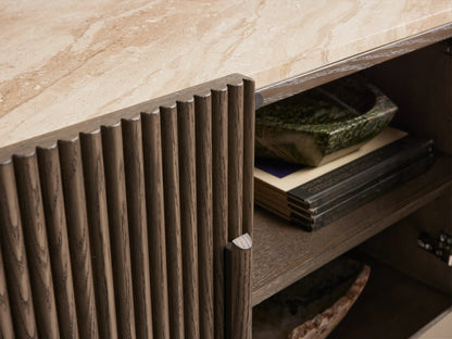 Astor Media Console: dark oak wood with vertical reeding, light marble top. Two central doors closed, two right doors open, showing shelves.