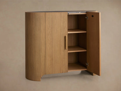 Astor Hall Chest made from oak with vertical reeding and wooden pulls. Inset marble top, brass or bronze accents, natural finish.