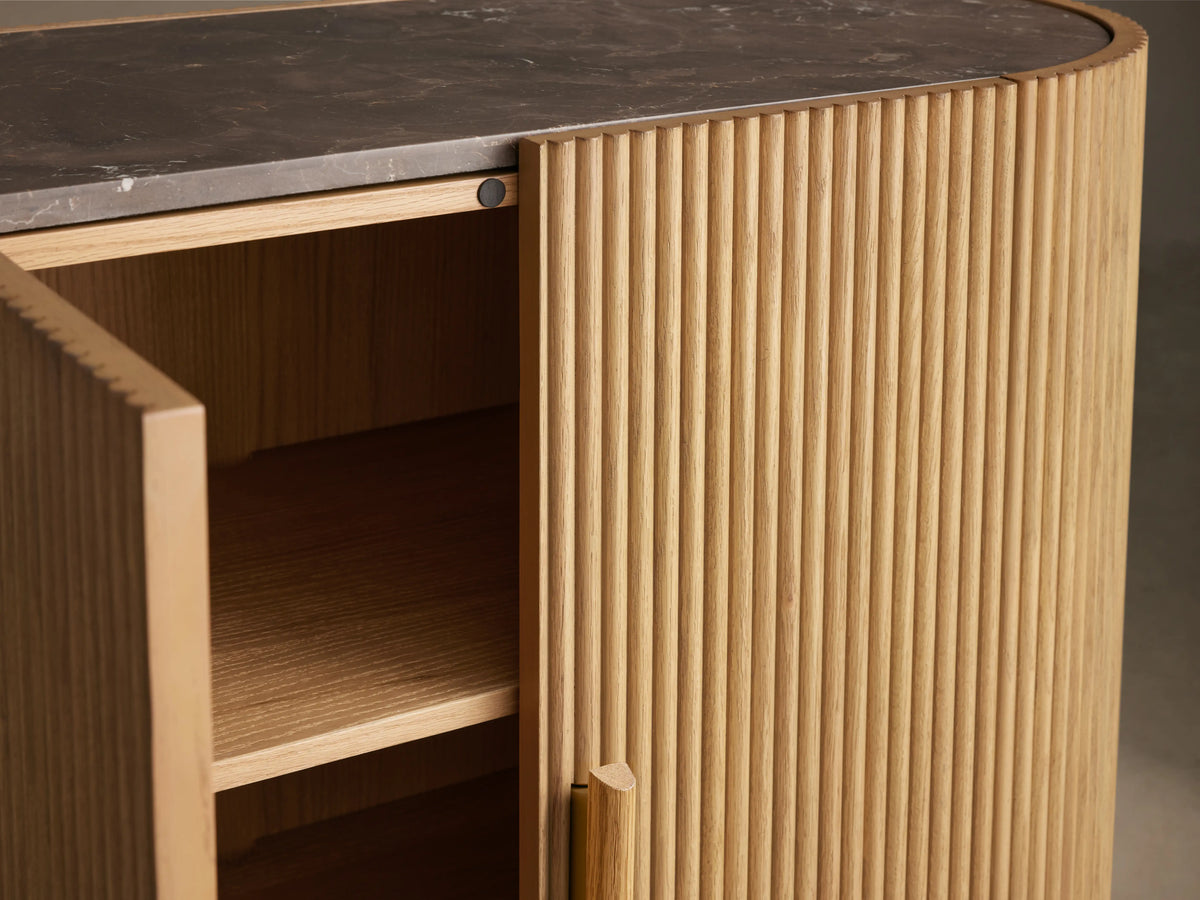 Astor Hall Chest with oak reeding, open soft-close door, wooden pull, shelves inside, and marble top.