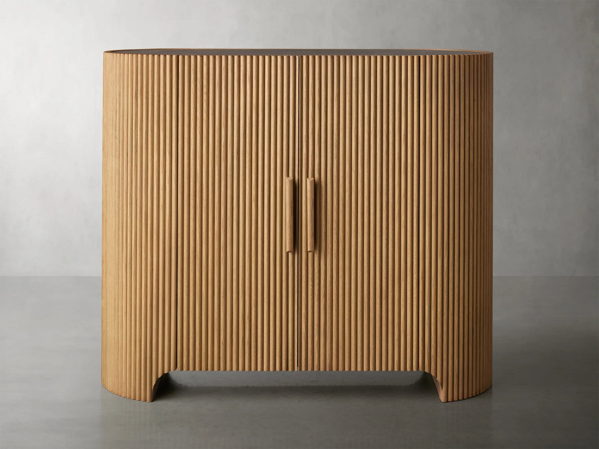 Close-up of the Astor Hall Chest showing ribbed oak veneer doors, open to reveal shelves, with a marble top surface.