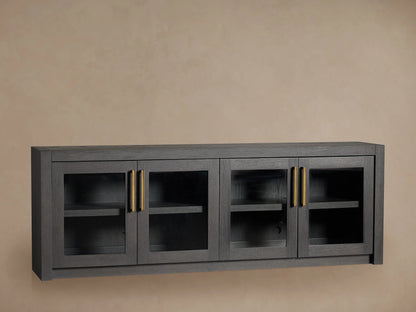 Bodhi Media Console made of dark oak with four glass-paneled doors, brass handles, and two adjustable shelves inside.