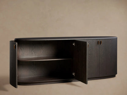 Abanos Bexler Sideboard, curved top. Left door open revealing 2 interior shelves; 2 right doors closed with antique bronze pulls.