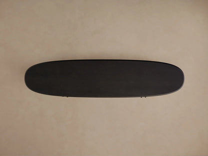 Dark, oval Bexler Sideboard, top-down view, showcasing its Abanos finish on a neutral background.