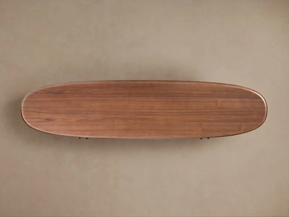 Bexler Sideboard: Top-down view of an elongated, oval-shaped warm brown wood surface with visible grain and rounded edges.