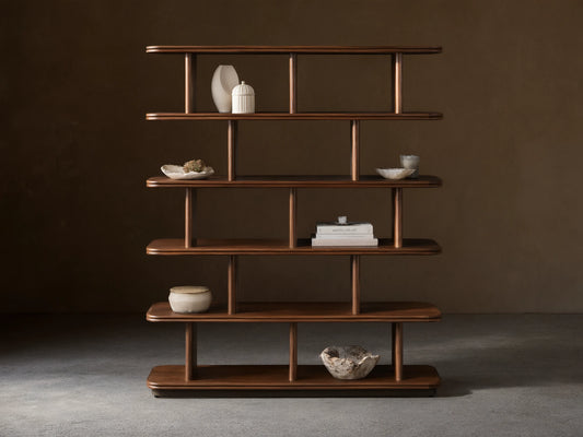 Front view of dark brown Caden Shelving, a tall wooden unit with five shelves, rounded edges, and cylindrical supports.