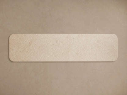 Long walnut wood veneer Caden Sideboard with rounded edges, cream stone top, four doors, and dark bronze handles.