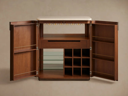 Dark walnut Caden Bar Cabinet interior with clear wine glasses hanging from an antique bronze rack, illuminated by warm LED light.