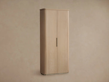 Light sand wood Caden Cabinet, tall with two doors, dark vertical handle, rounded corners, and a low plinth base.