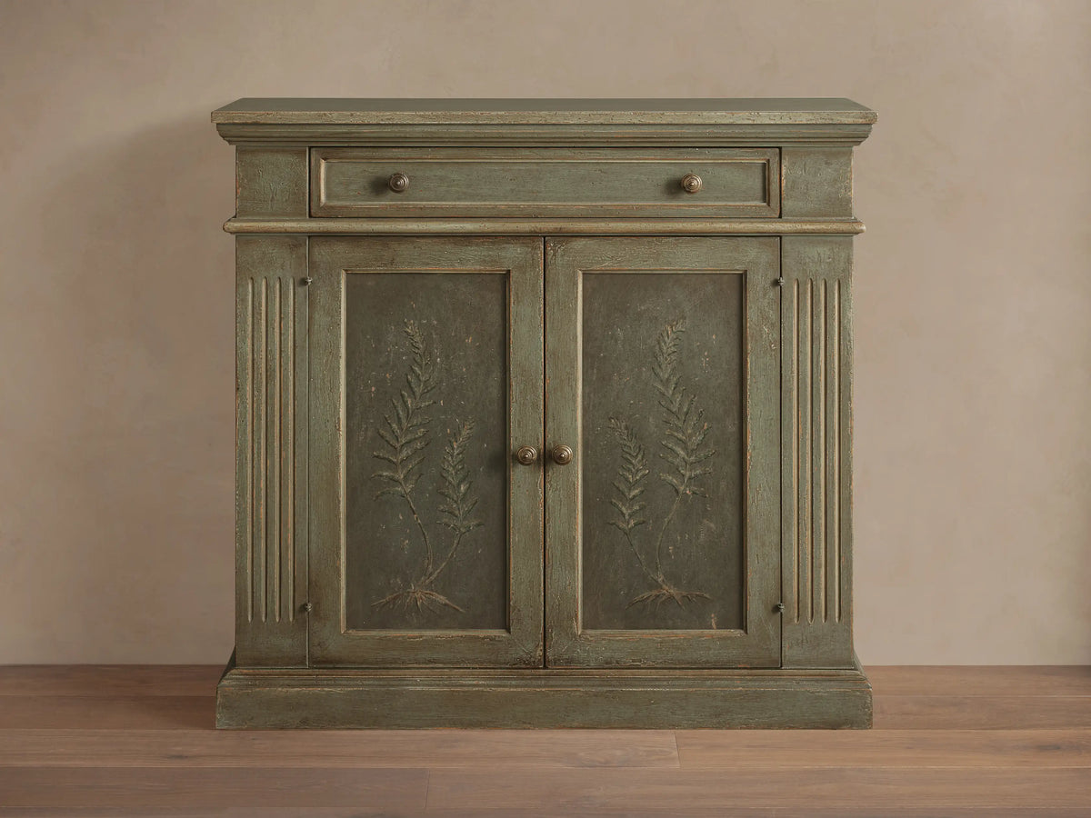 Cosetta Buffet, distressed sage green wood with top drawer, two doors, hand-painted ferns, fluted details & aged hardware.