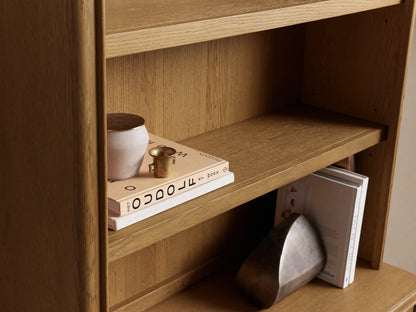 Carlisle Hutch, light oak wood, tall unit, 3 open shelves above 2 closed cabinets with small dark knobs.