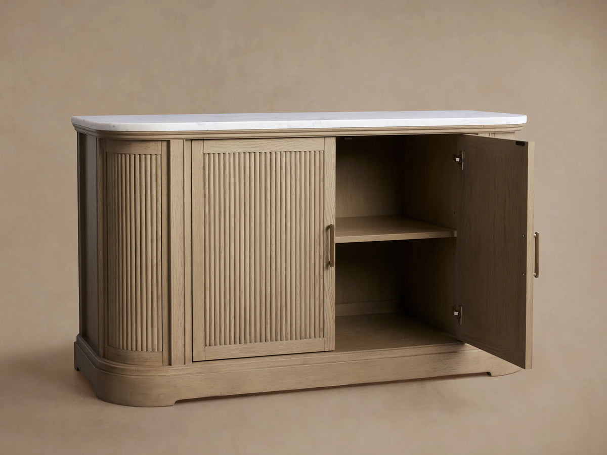Coventry Buffet: Light white oak wood buffet with fluted doors, antique brass handles, and a white Carrara marble top.