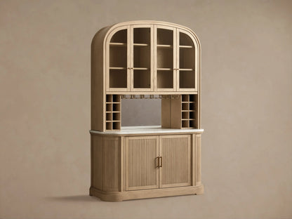 Coventry Bar: light oak, arched glass-door top, mirrored back, wine racks, white marble, fluted wooden base, brass handles.