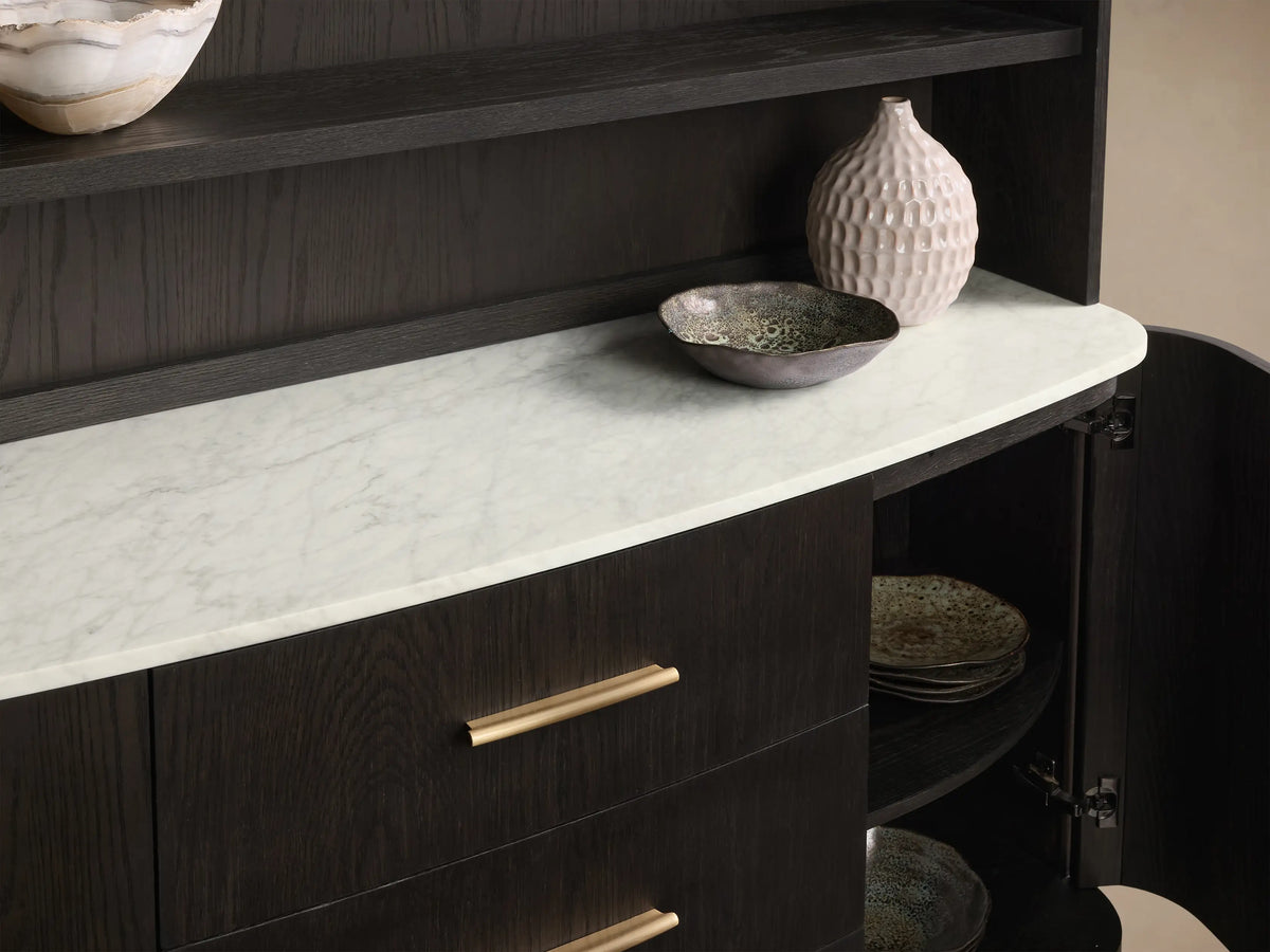 Front view of the Danny Hutch with Drawers, dark oak wood, white Carrara marble top, three shelves, three drawers with gold pulls.