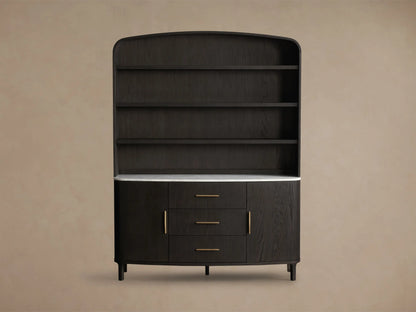 Close-up of dark oak Danny Hutch with Drawers. White Carrara marble top, gold handles, open cabinet revealing shelves.