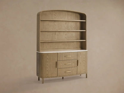 Front view of the light oak wood Danny Hutch with Drawers, featuring an arched top with three open shelves, a white marble counter, three central drawers, and two curved side cabinets with brass-toned handles.