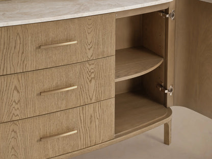 Close-up of the Danny Hutch with Drawers. Light oak wood, three drawers with brass handles, open cabinet with a rounded shelf, and marble top.