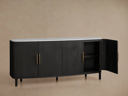 Danny Sideboard with a black oak wood finish and brass handles, featuring a white Carrara marble top. Right door open showing shelves.