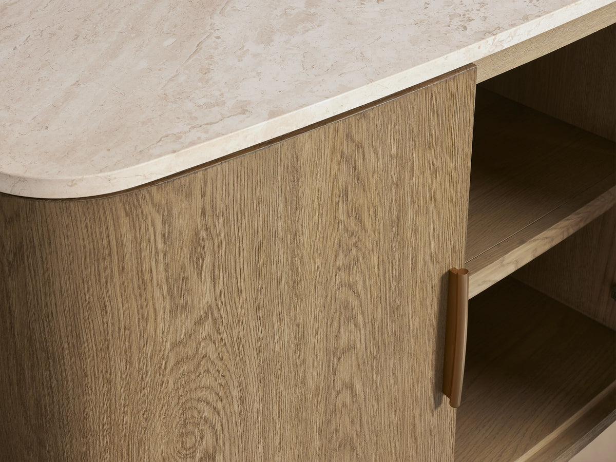 Oak wood Danny Sideboard with brass-finished handles and a white Carrara marble top. Features curved edges and sleek design.