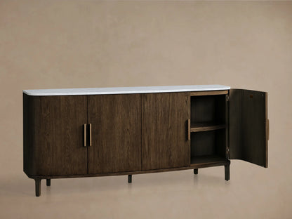 Front view of a dark brown wooden sideboard with a white marble top, rounded edges, four doors, and vertical brass handles.