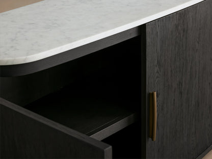 Danny Sideboard in ebony finish with white Carrara marble top, open door showing interior shelf, brass handle visible.
