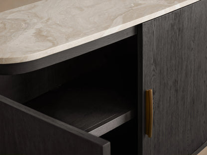 Danny Sideboard with open dark oak cabinet door, brass handle, and light marble top displaying unique veining.