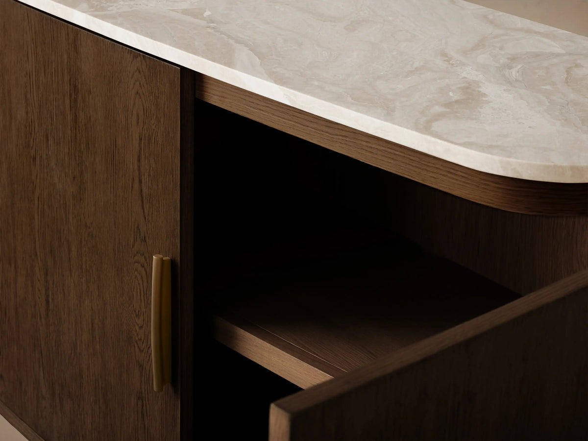 Front view of a dark brown wooden sideboard with four doors, a white marble top, and one door open revealing two shelves.