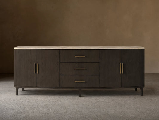 Front view of the dark oak Danny Sideboard with Drawers, featuring a royal cream marble top, two side cabinets, and three central drawers with brass pulls.