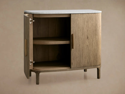 Danny Cabinet in oak with a hand-applied fawn finish, white marble top. Open door reveals interior shelf.