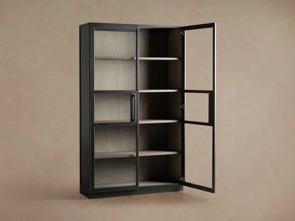 Factory Cabinet with a dark Usine Black finish, displaying tempered glass doors showing visible shelves in a chic grey Stone finish.