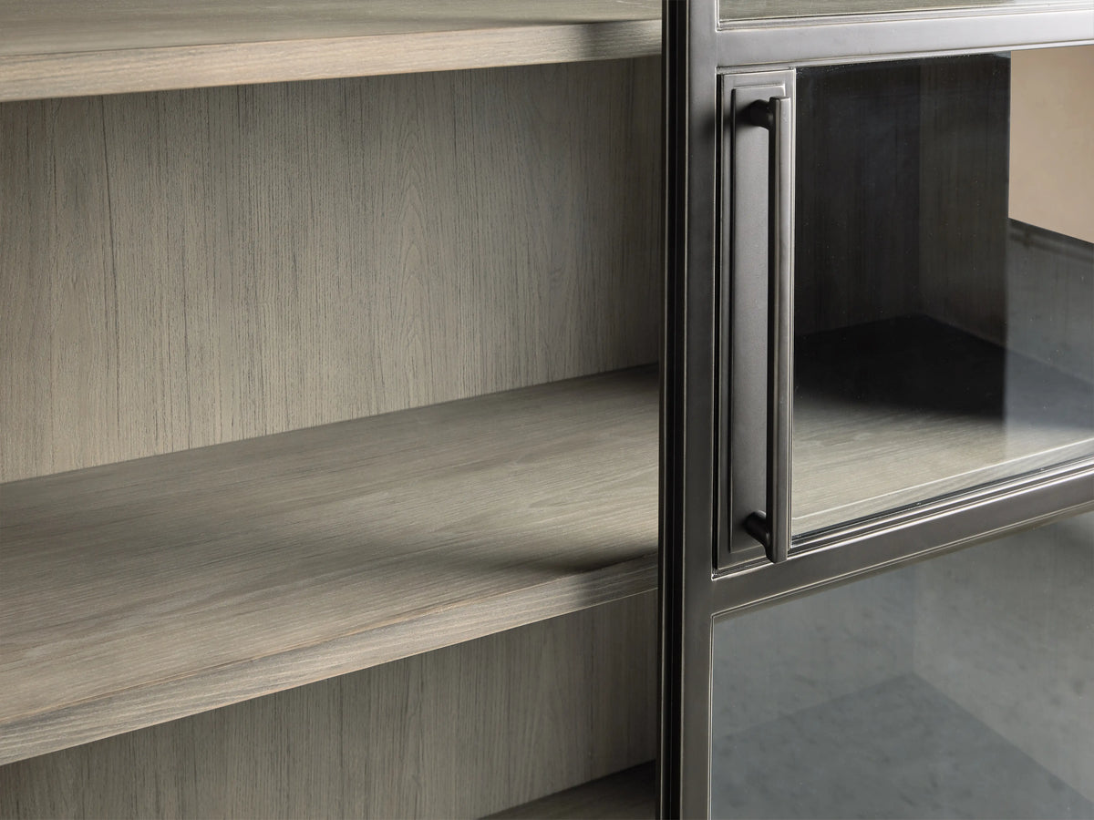 Factory Cabinet in Usine Black with tempered glass door open, revealing shelves with grey Stone finish inside. Solid iron handle on left side.