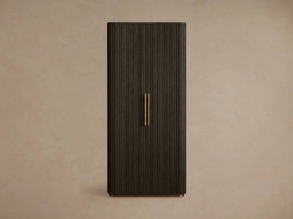 Dark brown Finnley Cabinet with a fluted door partially open, showcasing a brass handle and interior shelves with books.