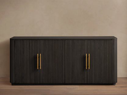 Finnley Wood Sideboard with ebony finish, ribbed surface, and brass-finished handles; set against a neutral background.
