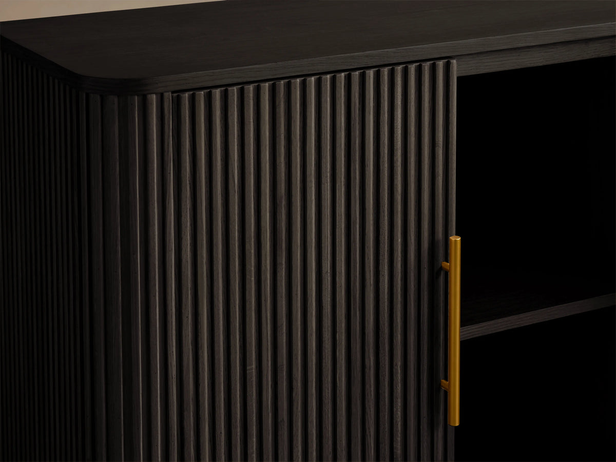 Finnley Wood Sideboard in ebony finish with ribbed texture, open door showing shelves, brass-finished handles, against neutral background.