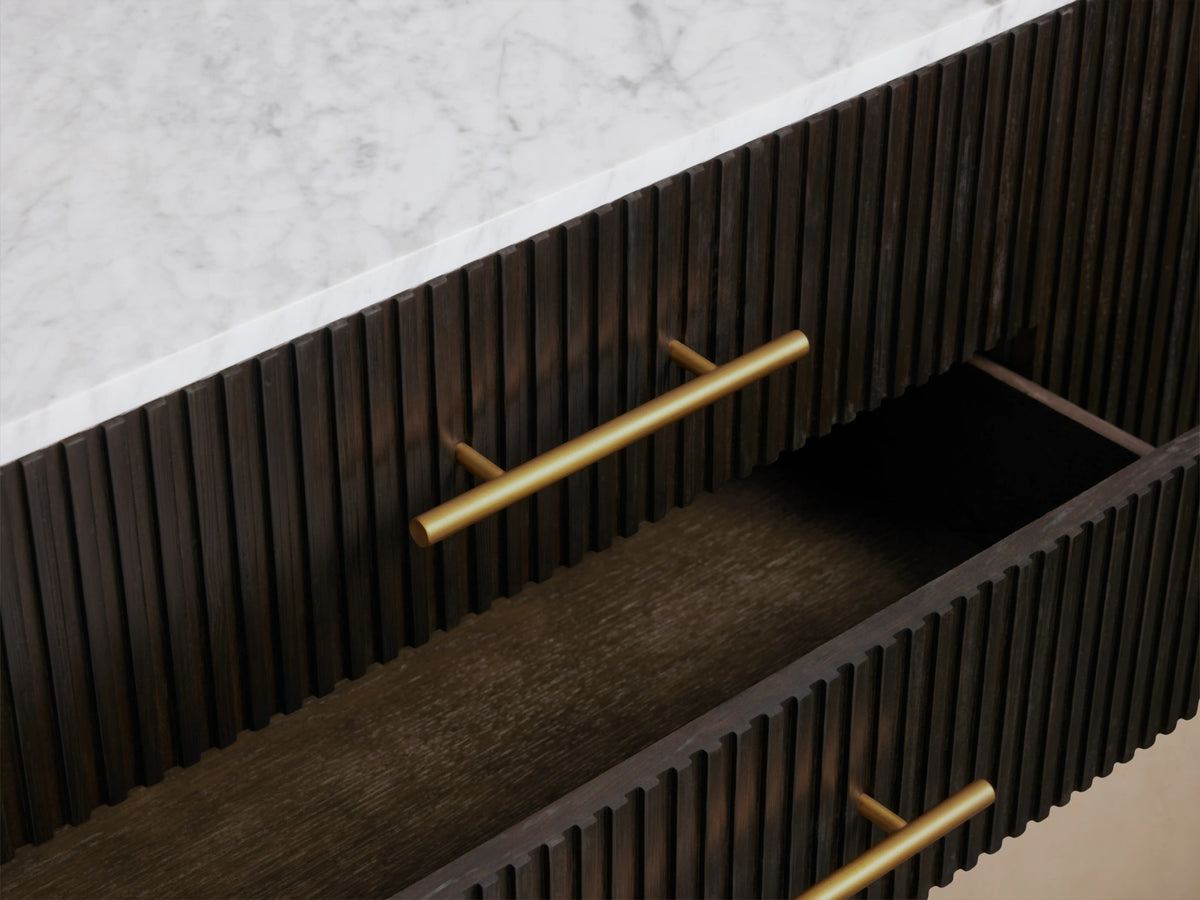 Finnley Sideboard featuring a dark wood finish, brass hardware, three drawers, and open cabinet doors, with a marble top.