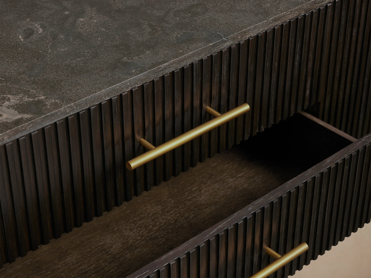 Finnley Sideboard with Ebony finish, featuring fluted design, three drawers open, one cabinet door ajar, brass hardware.