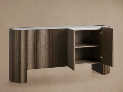 Flore Sideboard with reeded oak wood detailing, open right door revealing two shelves, inlaid marble top, on beige background.