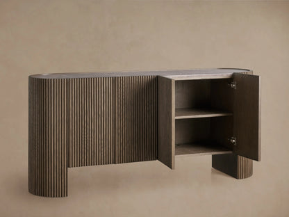Flore Sideboard with reeded oak wood detailing, open soft-close door revealing two shelves, and a stone top surface.