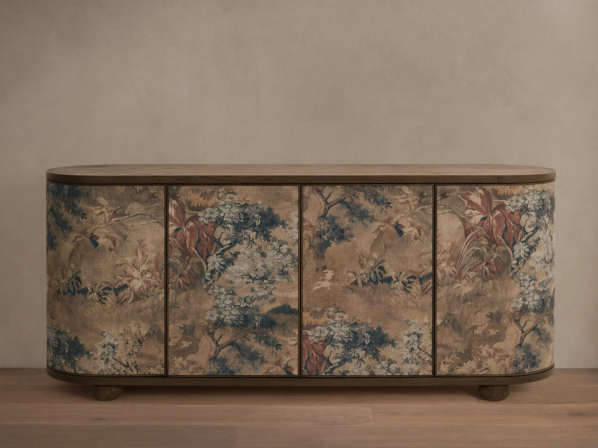 Front view of Fresca Sideboard with rounded ends, light brown wood top and base, and a linen fabric overlay with muted nature motifs.