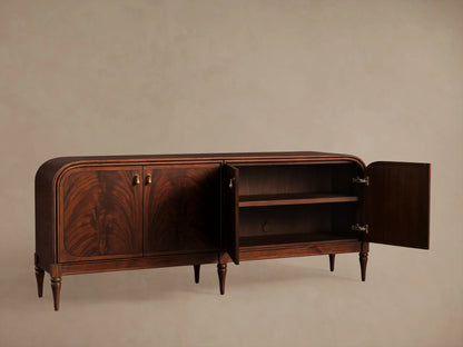 Frances Sideboard, dark mahogany with book-matched flame veneer on 4 doors, brass pulls, rounded corners, tapered legs.