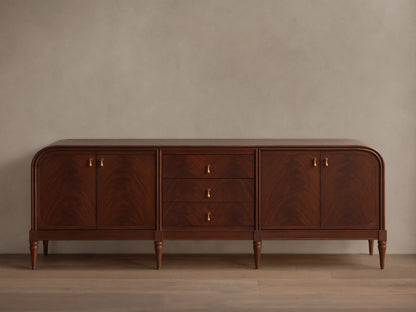 Front view of the Frances Sideboard with Drawers, featuring dark brown wood, rounded ends, three drawers, and brass pulls.