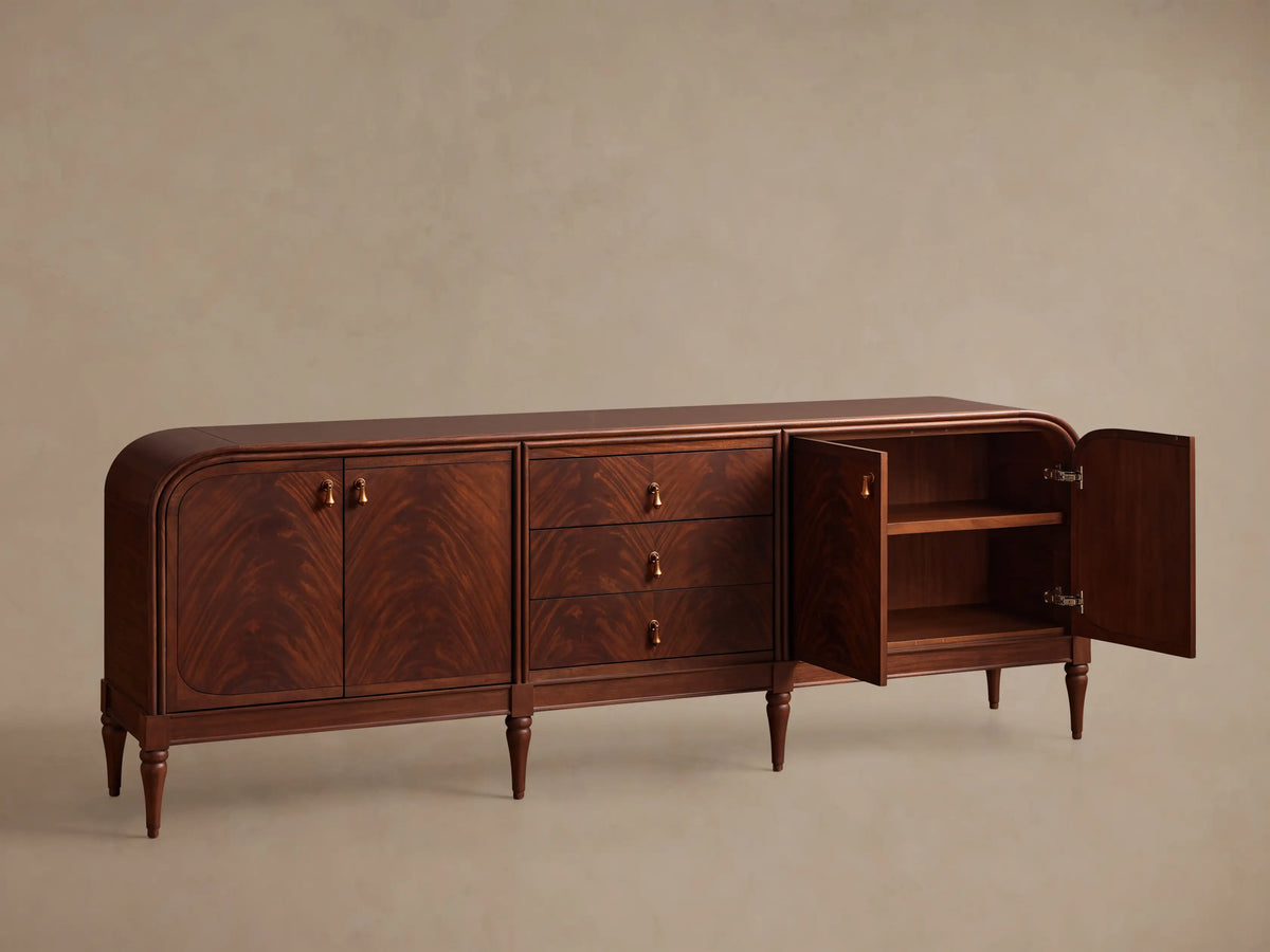 Front view of the Frances Sideboard with Drawers, featuring dark brown wood, rounded ends, three drawers, and brass pulls.
