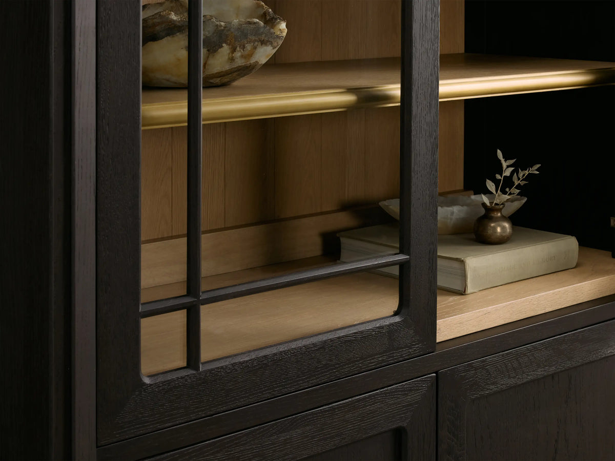 Front view of dark brown Gatlin Glass Cabinet with arched top, framed glass doors, and brass hardware.