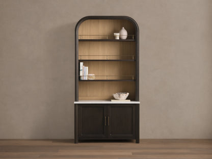 Front view of the Gatlin Hutch, a dark mocha wood hutch with an arched top, natural wood back panel, white marble, and brass accents.