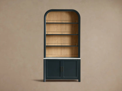 Detail view of the Eclipse Gatlin Hutch with white honed Carrara marble workspace, natural wood backing, and brass accents.