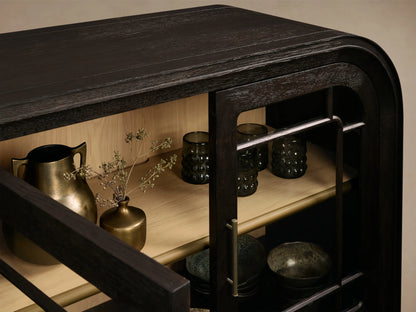 Front view of the mocha Gatlin Sideboard with four tempered glass doors, antique brass pulls, and internal wood shelves.