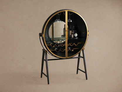 Circular Gideon Bar Cabinet with open doors, featuring dark wood interior, gold accents, built-in glass rack, and bottles inside.